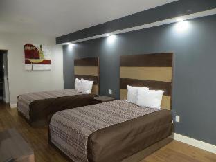 Grand Villa Inn & Suites Chinatown Houston Habitación foto